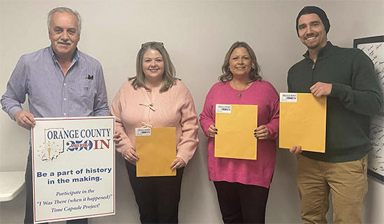 Orange County Community Foundation staff members Kristina Allen, Jessica Meeks and Brandon Query are seen with their Orange County 250 Time Capsule packets.